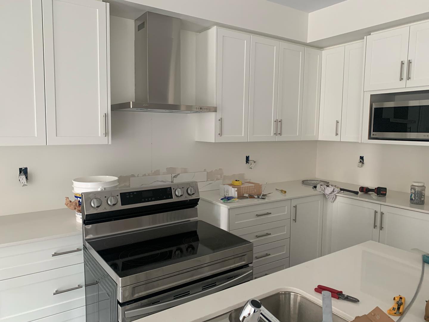 Kitchen renovation with cabinetry and counters installed